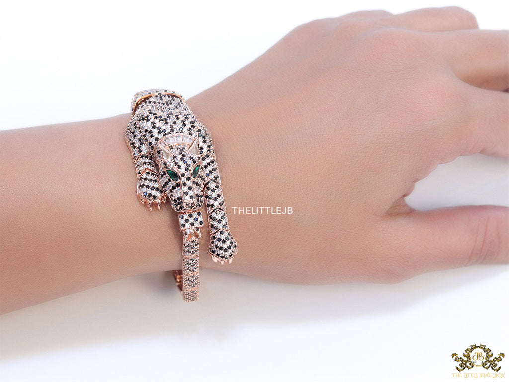 Cubic zirconia stone studded panther motif with emerald green colour stone details rose gold plated bracelet