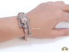 Cubic zirconia stone studded panther motif with emerald green colour stone details rose gold plated bracelet