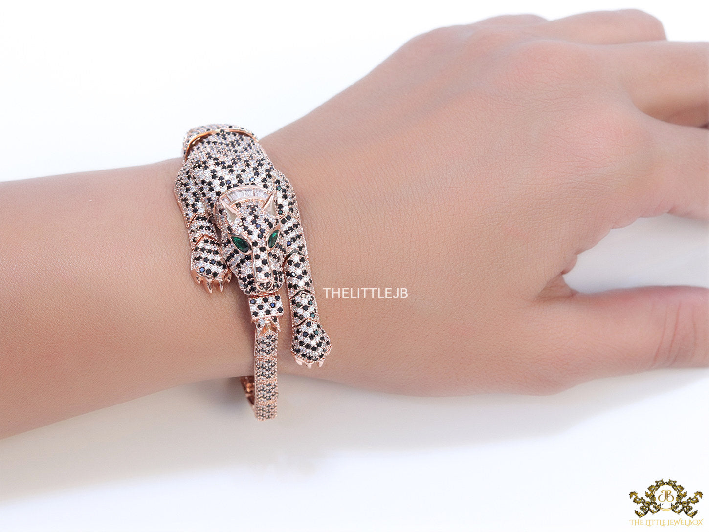 Cubic zirconia stone studded panther motif with emerald green colour stone details rose gold plated bracelet