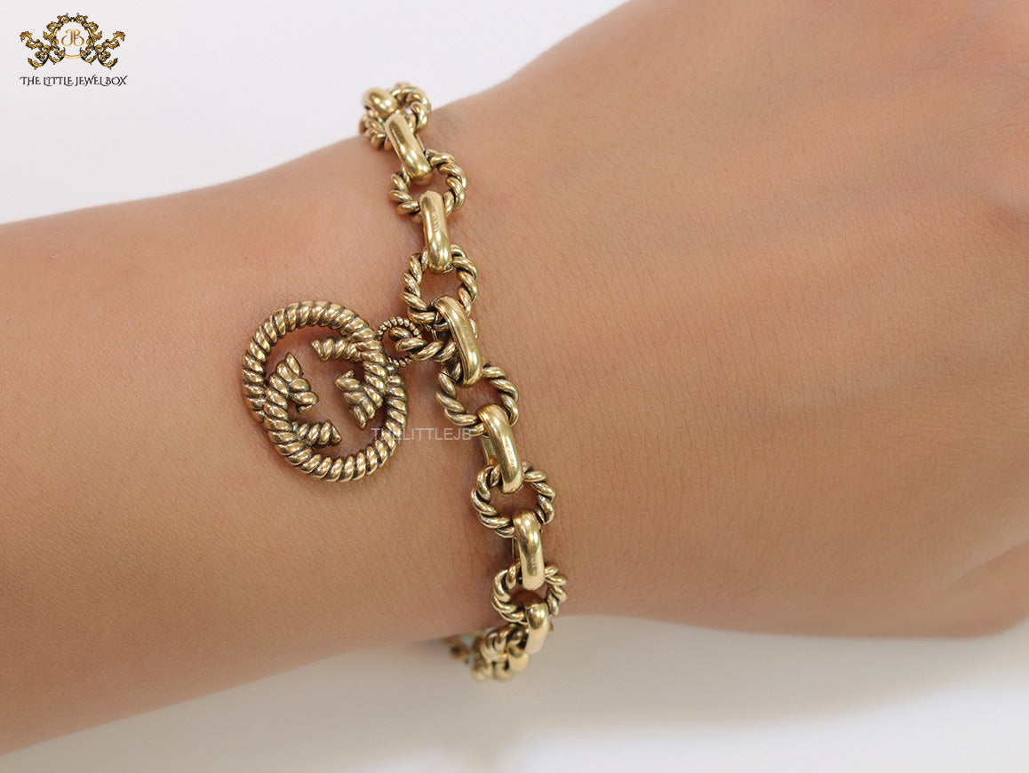 Fancy link chain antique gold finish bracelet with double G motif