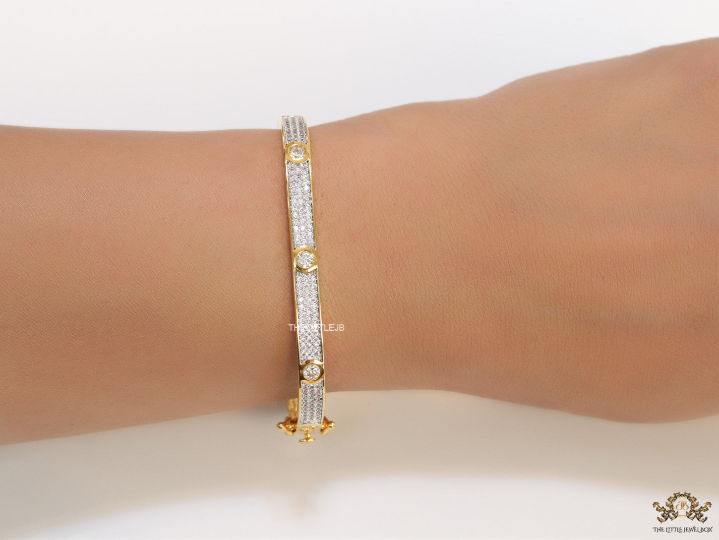 Gold plated openable bracelet studded with cz