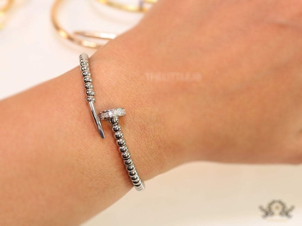 Platinum plated cz and metallic bead nail bracelet-openable