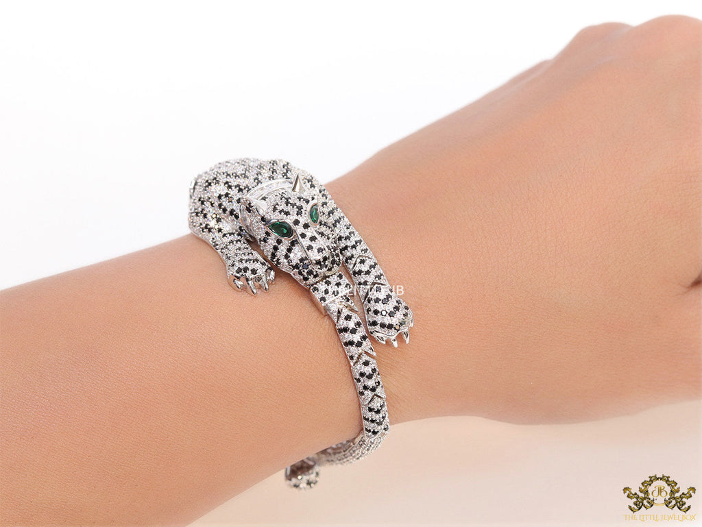 Cubic zirconia stone studded panther motif with emerald green colour stone details platinum plated bracelet