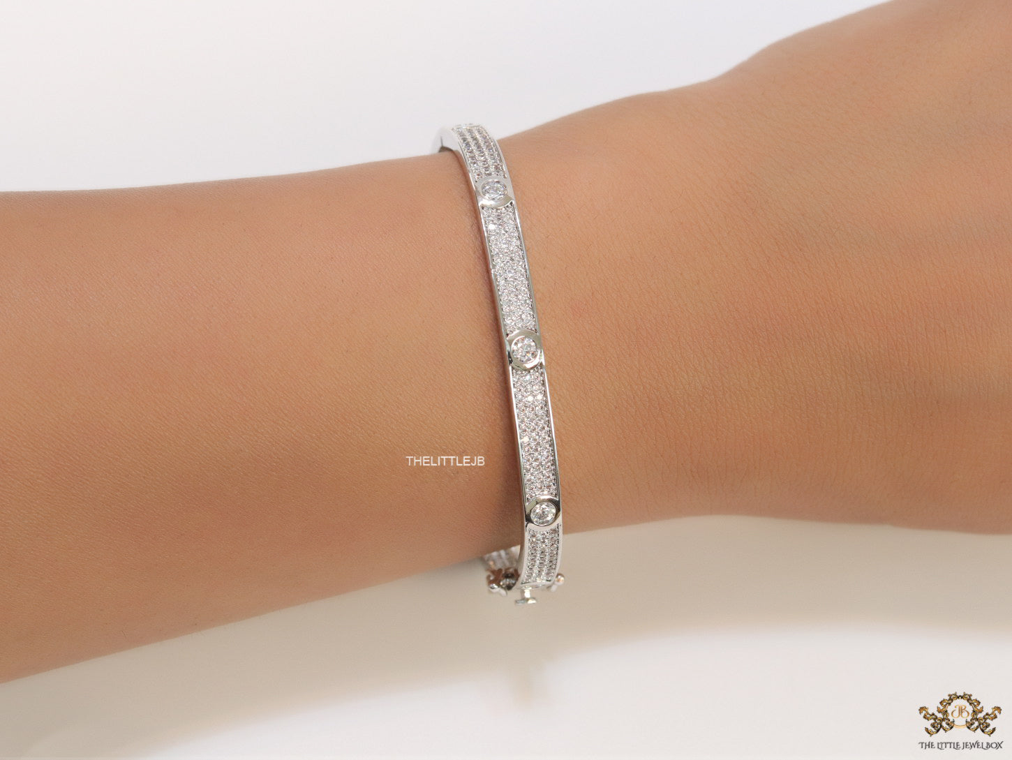 Platinum plated openable bracelet studded with cz