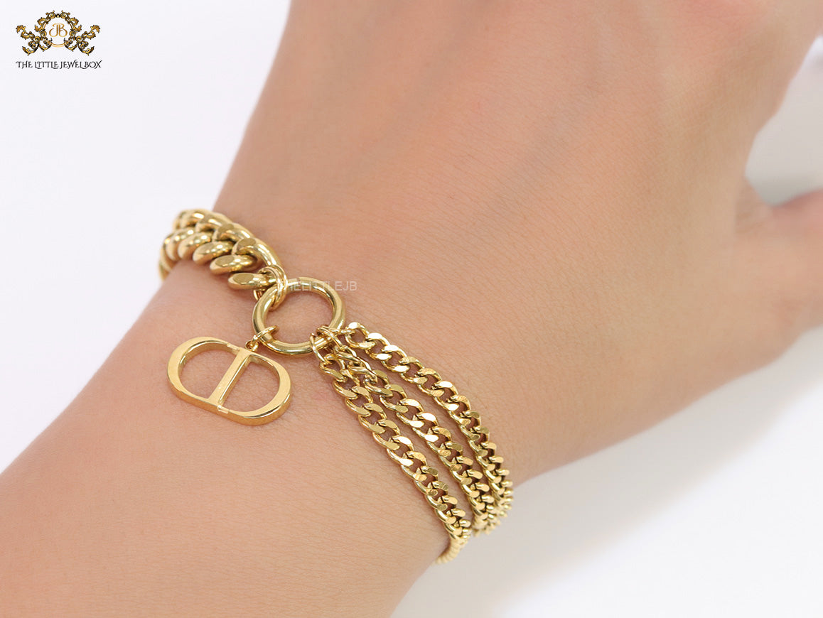 Multiple chain golden bracelet with C and D alphabets