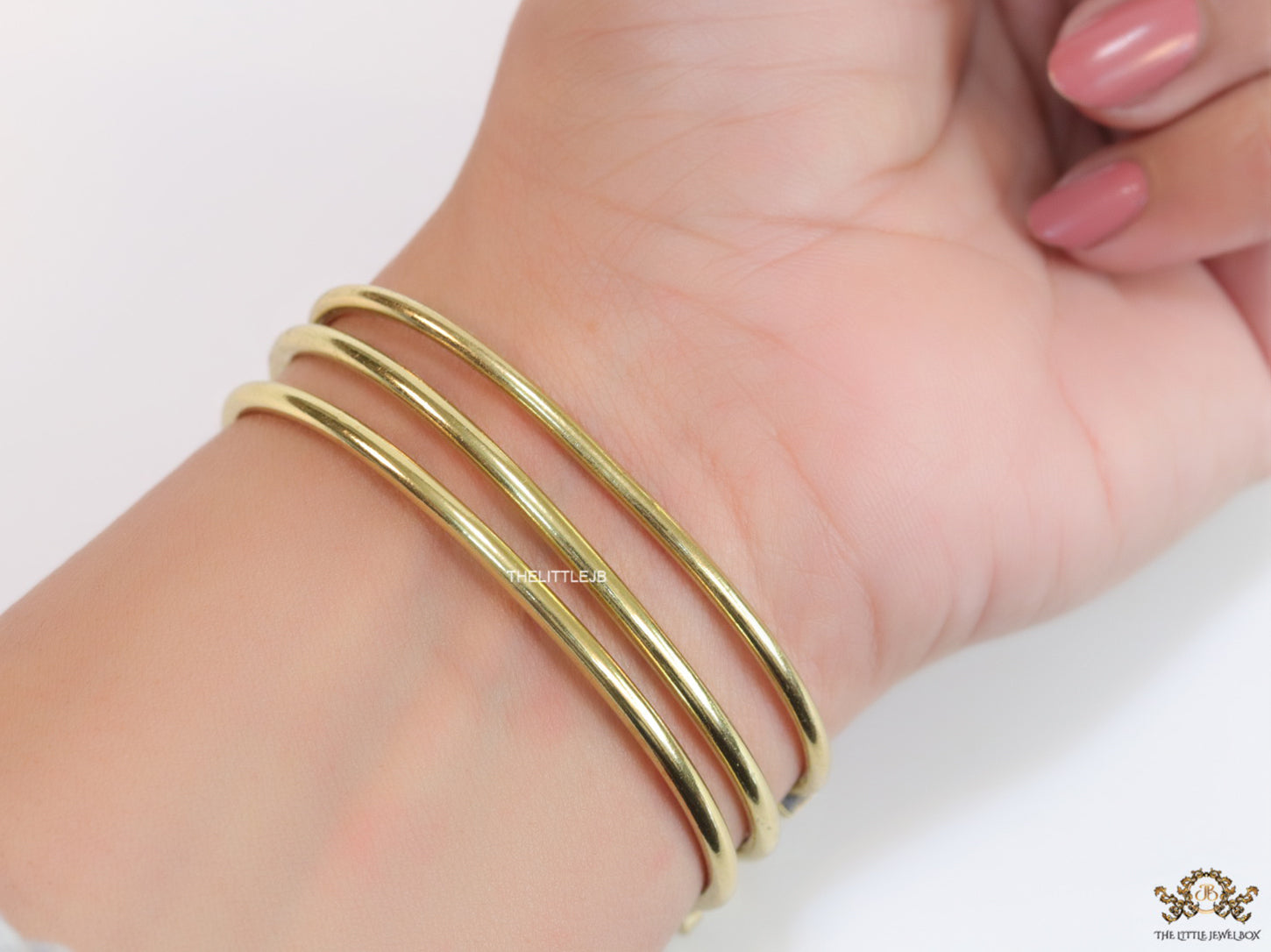 Multilayered golden alphabet bracelet with cz