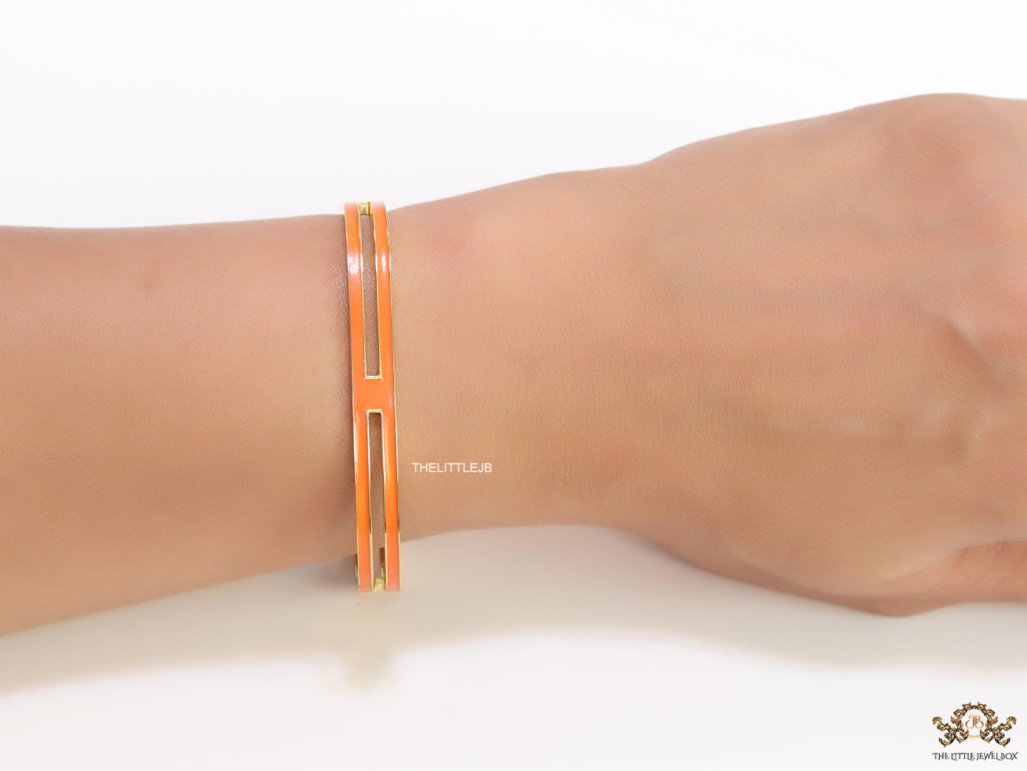 Gold plated two layer solid orange bracelet