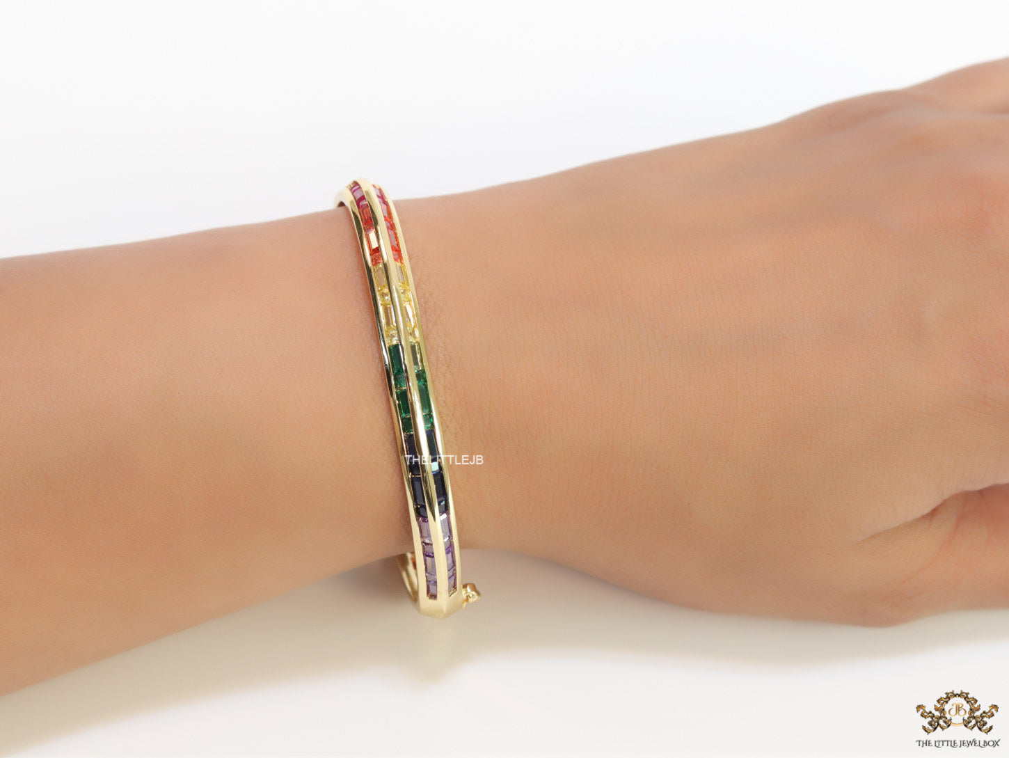 Openable Gold plated bracelet with multi cz baguettes