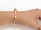 Gold plated bracelet with alphabet inscribed motif