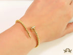 Gold plated openable nail bracelet with cz and metallic beads