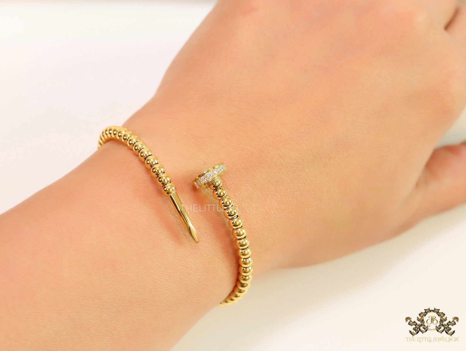 Gold plated openable nail bracelet with cz and metallic beads