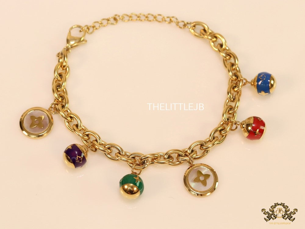 Gold plated link chain bracelet with multi enamel and MOP charms