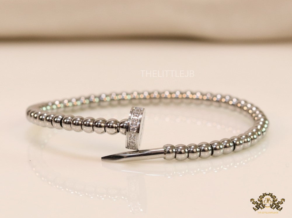 Platinum plated cz and metallic bead nail bracelet-openable