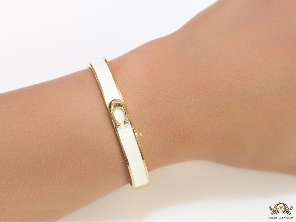 Sleek white and golden bracelet with C alphabet in centre