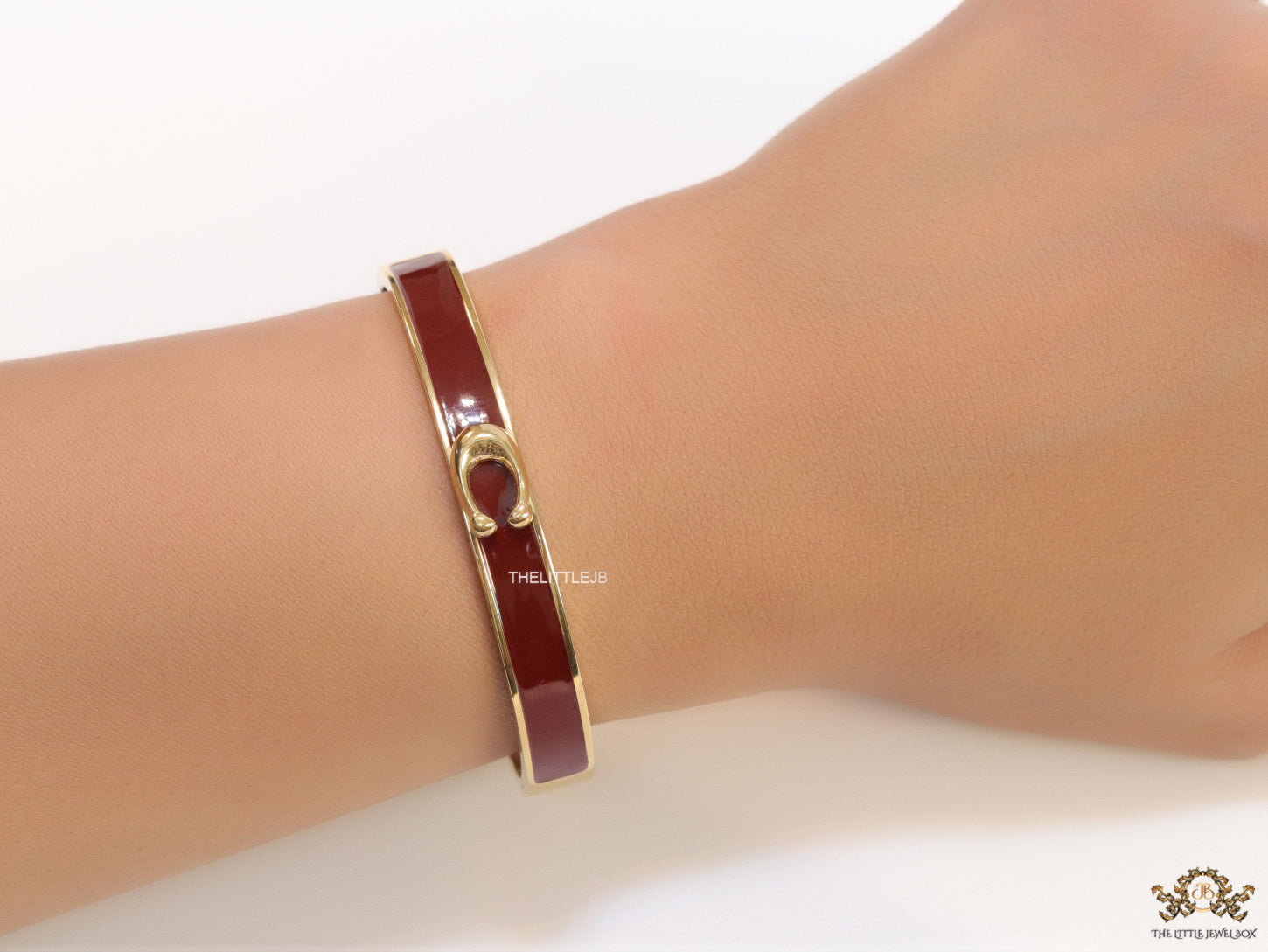 Sleek maroon and golden bracelet with C alphabet in centre