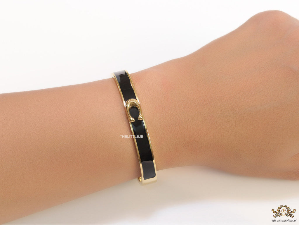 Sleek black and golden bracelet with C alphabet in centre