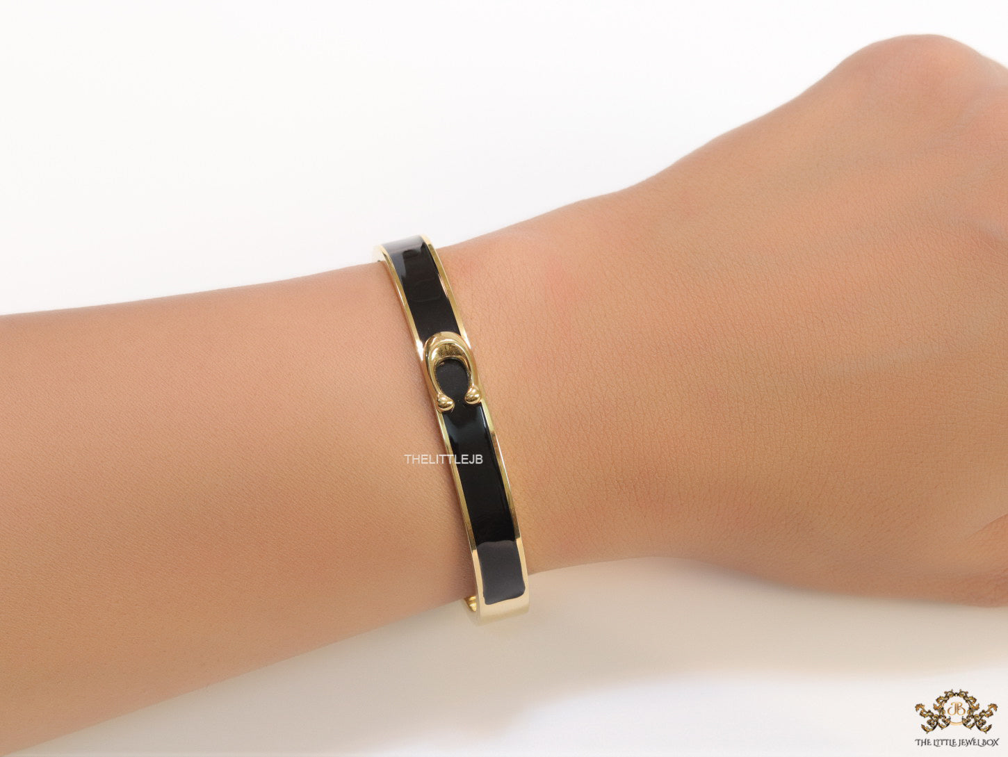Sleek black and golden bracelet with C alphabet in centre