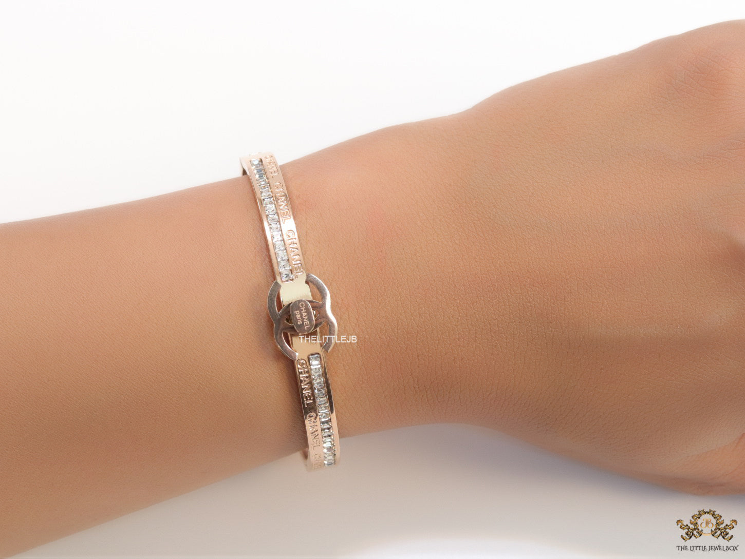 Rose gold plated bracelet with cz, inscribed alphabets and twin disc motif