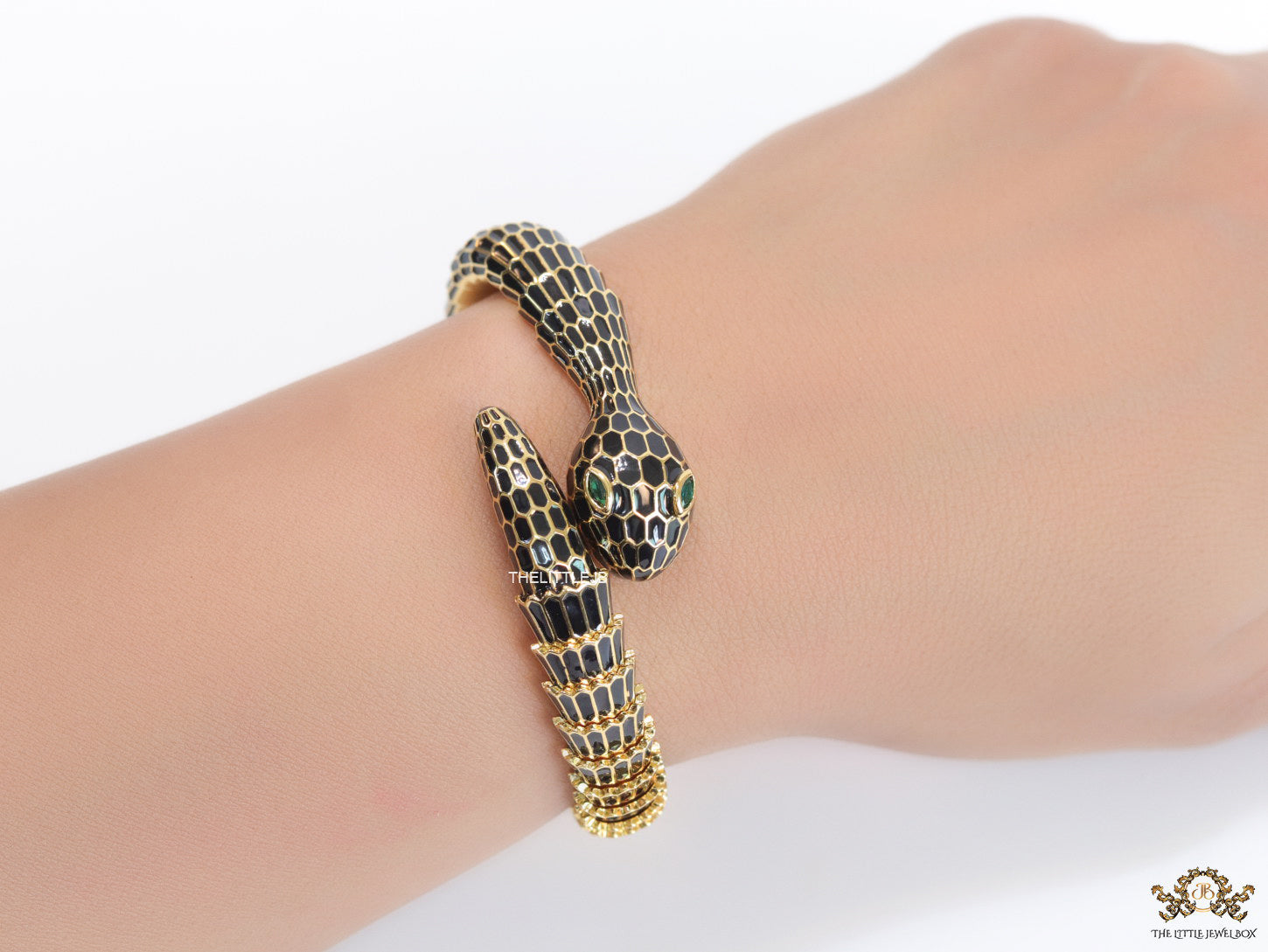 Serpentine open bracelet in black and golden finish