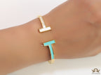 Gold plated open bracelet with blue enamel and MOP ends