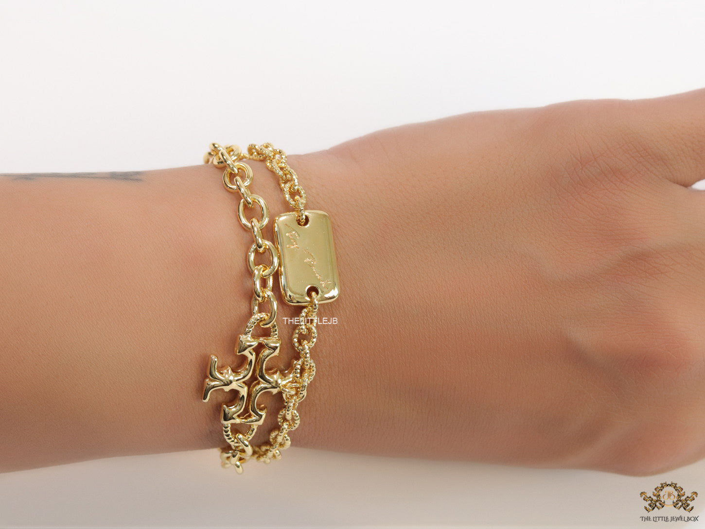 Gold plated two layered link chain bracelet with T motif