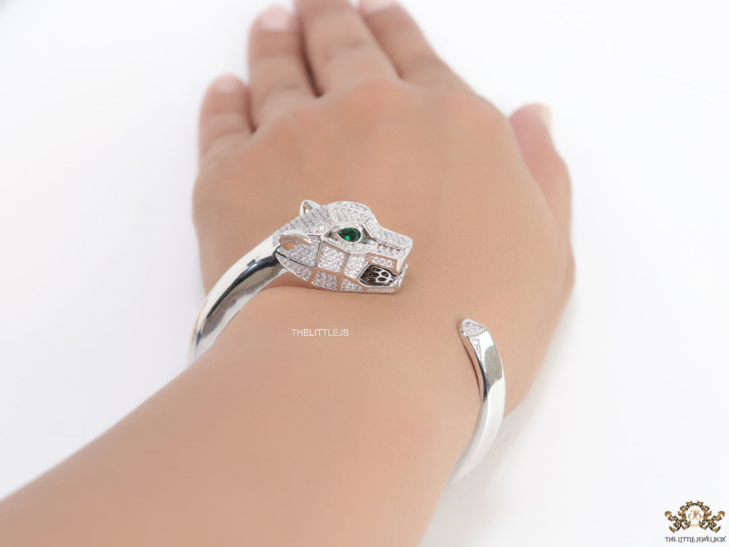 Platinum plated open panther bracelet with cz