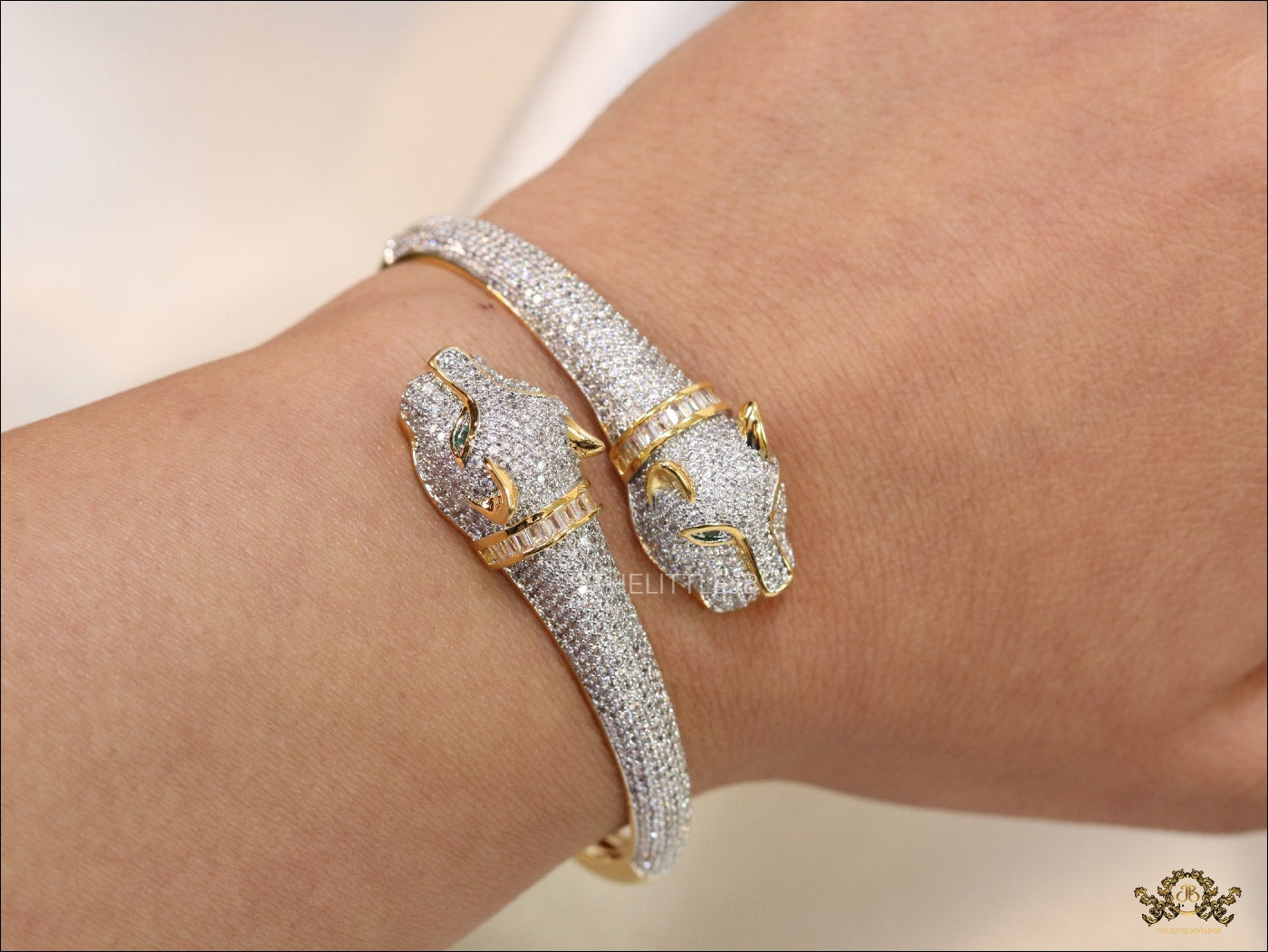 Gold plated cz twin panther openable bracelet