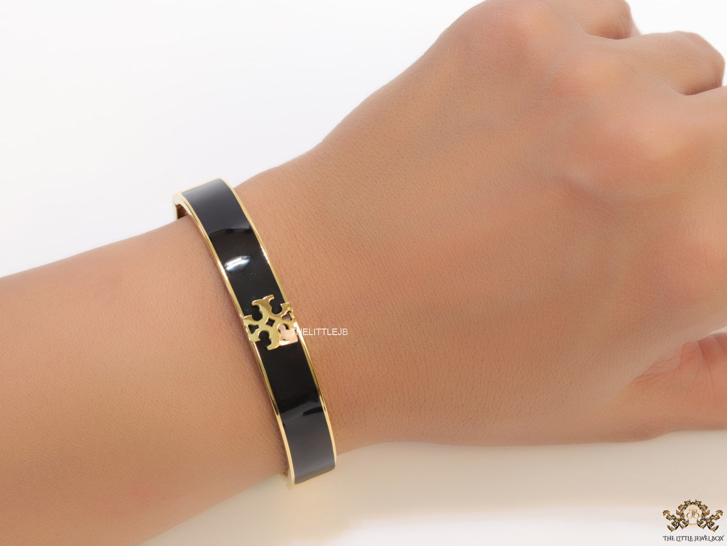 Golden and black bracelet with T motif
