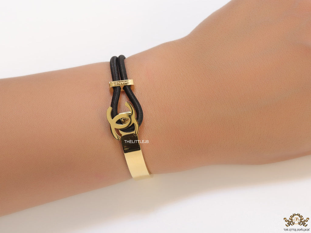 Black and golden designer bracelet with twin C motif