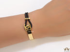Black and golden designer bracelet with twin C motif