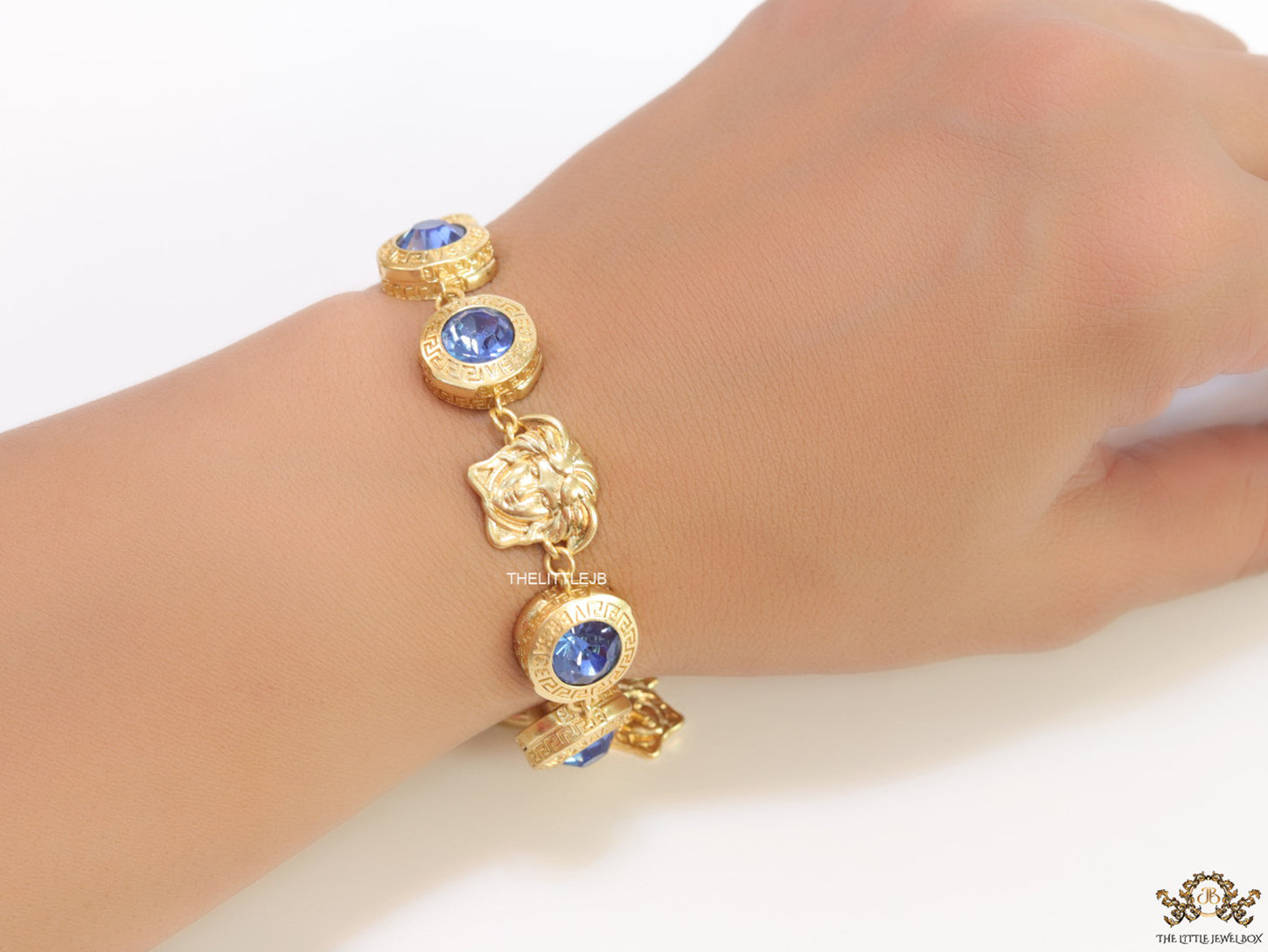Designer golden Medusa chain bracelet with fancy cut cz
