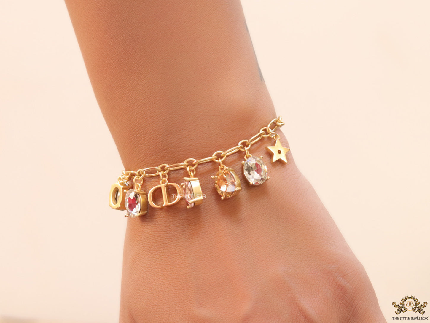 Golden chain bracelet with alphabet and cz charms