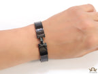 Broad black bracelet with H alphabet in centre