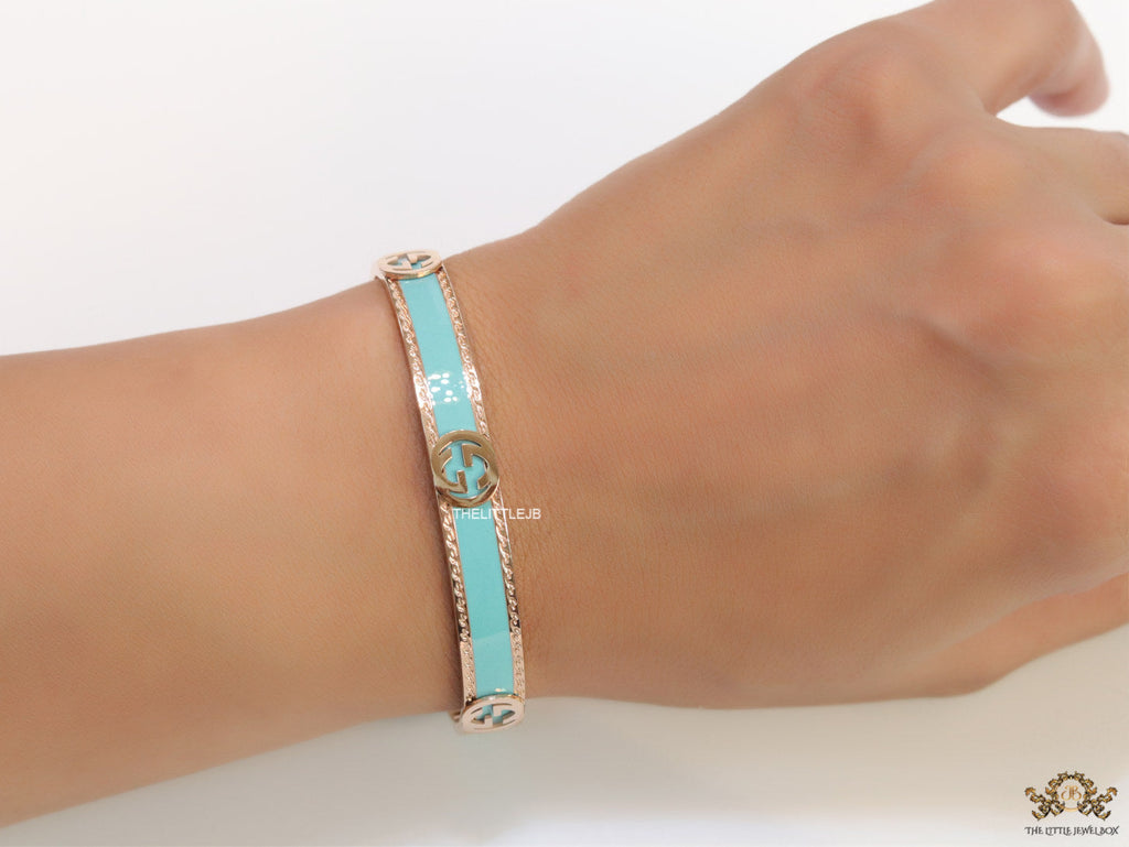 Blue and Rose gold open band bracelet with twin G alphabet motifs