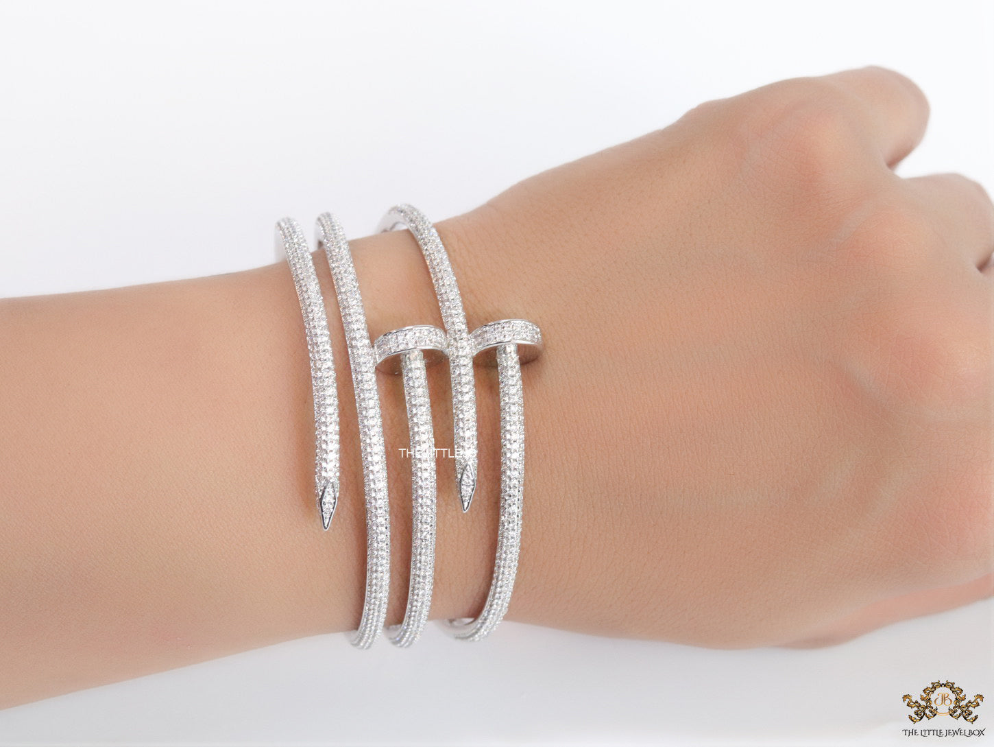 Platinum plated twin nail bracelet with cz
