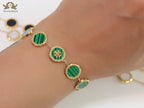 Gold plated chain bracelet with T motif on malachite green discs