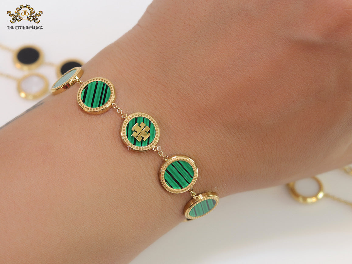 Gold plated chain bracelet with T motif on malachite green discs