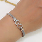 Platinum plated watch strap bracelet with V motif