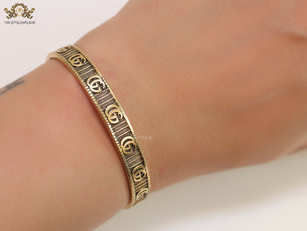 Open Gold plated double G motif bracelet in antique finish