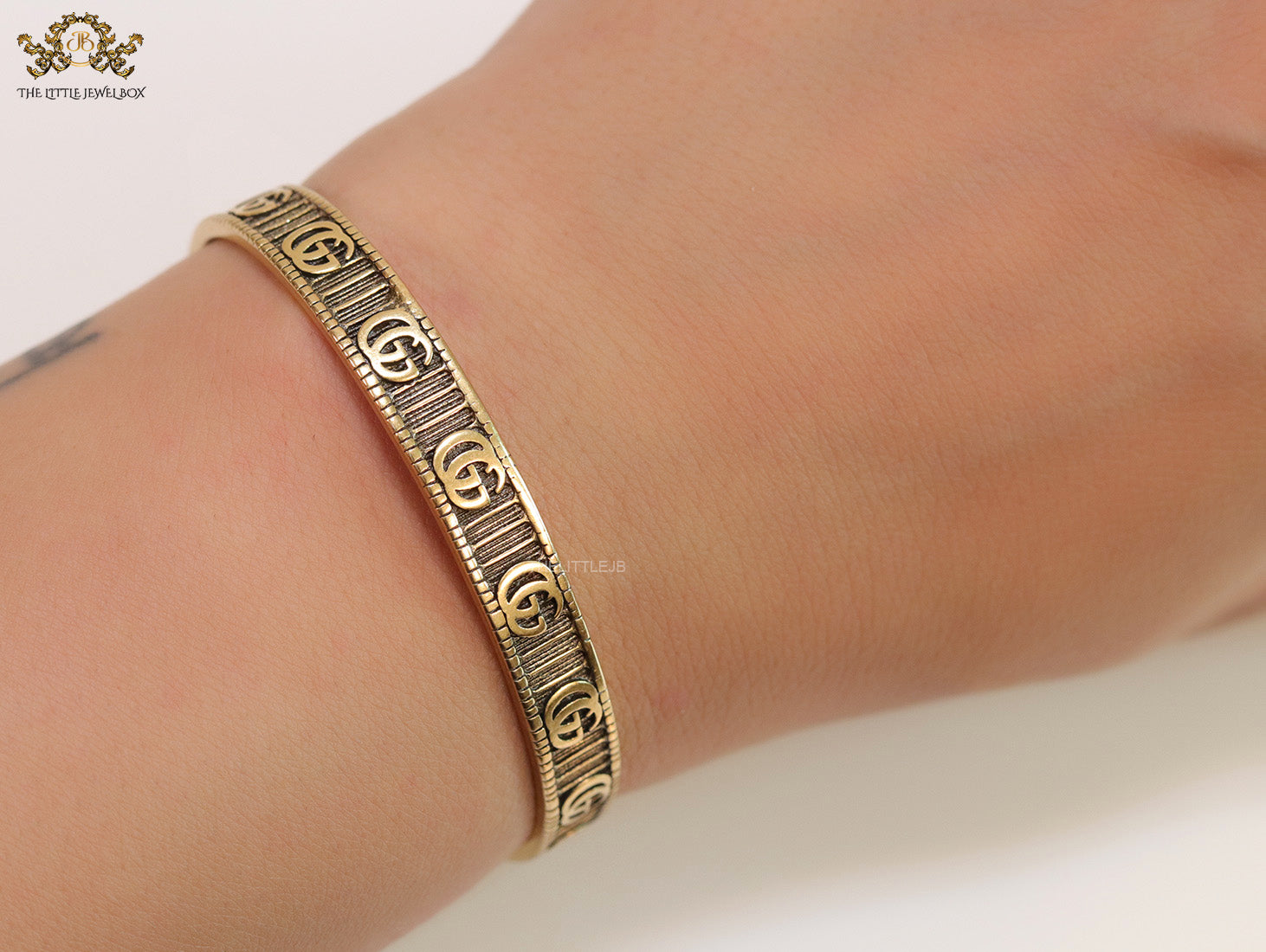 Open Gold plated double G motif bracelet in antique finish