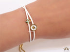 Adjustable double string white bracelet with twin T motifs