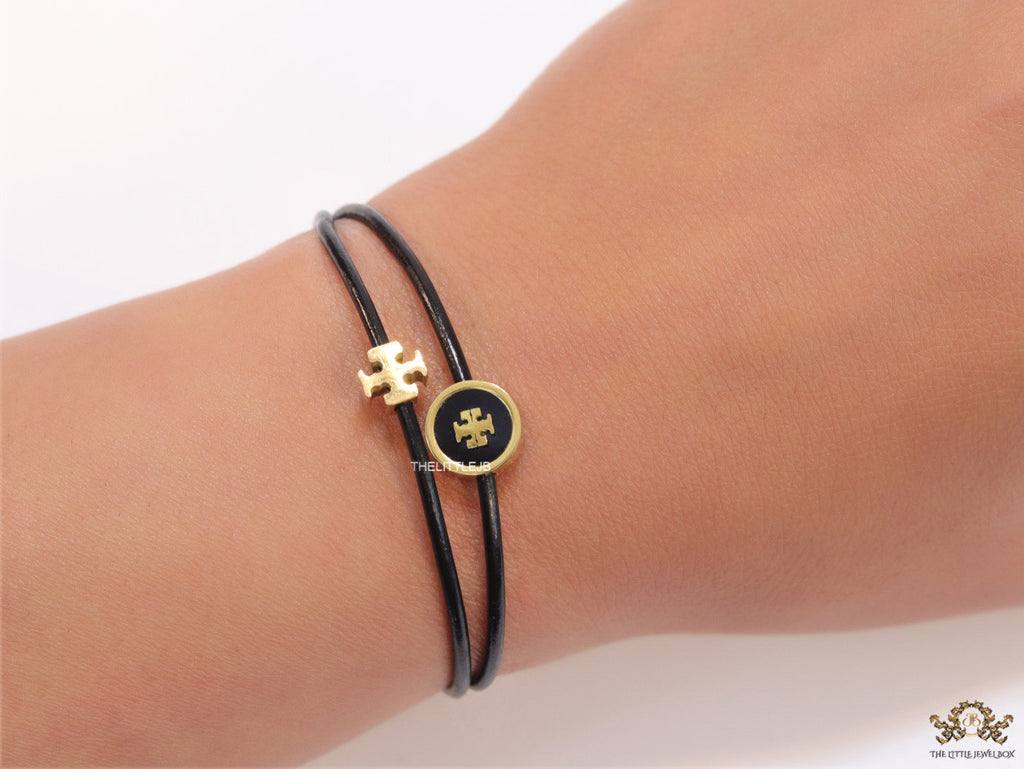 Adjustable double string black bracelet with twin T motifs