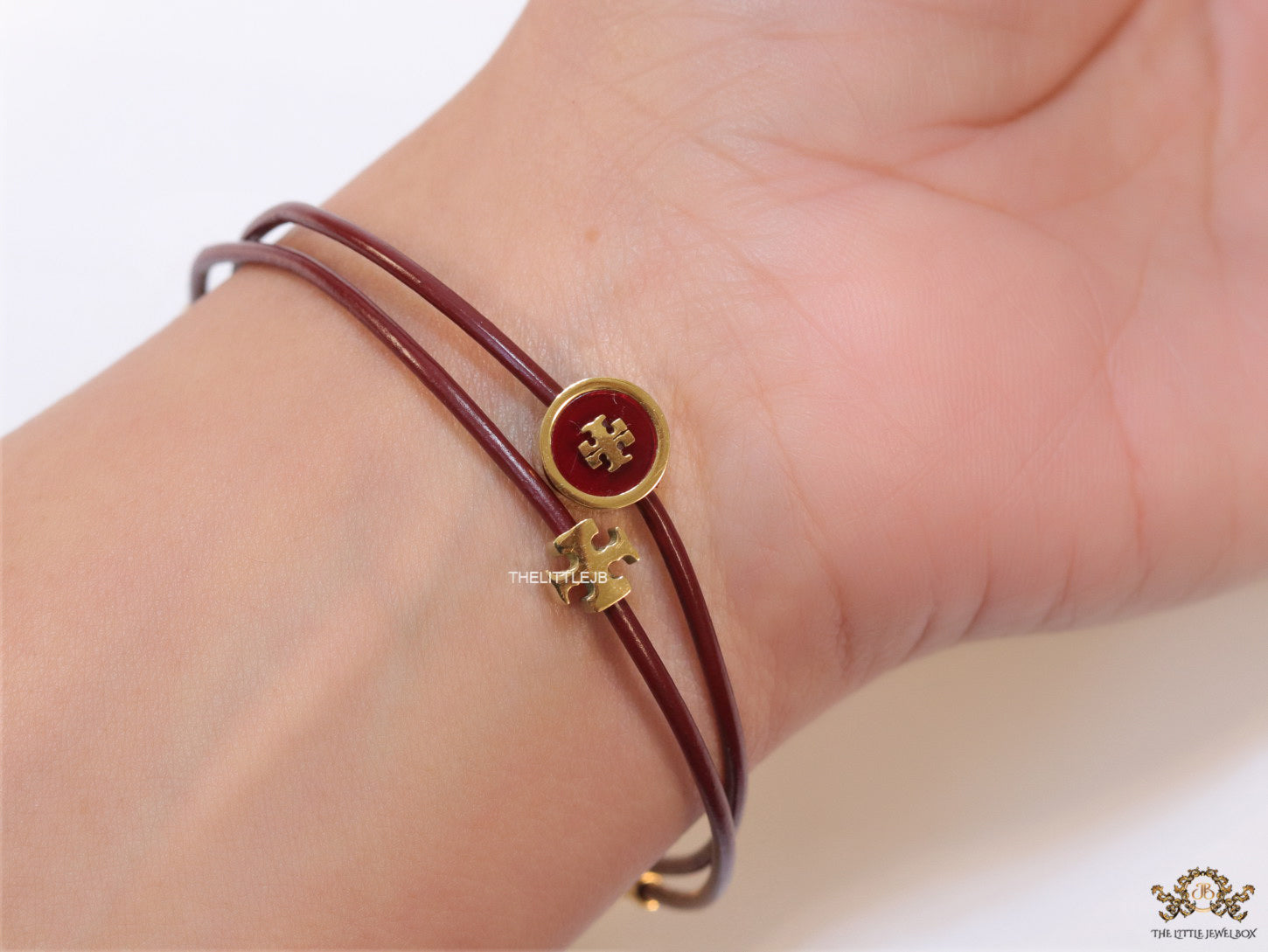 Adjustable double string maroon bracelet with twin T motifs