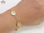 Gold plated sleek chain bracelet with MOP discs