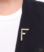 Gold plated alphabet F brooch with baguette cubic zirconia stone