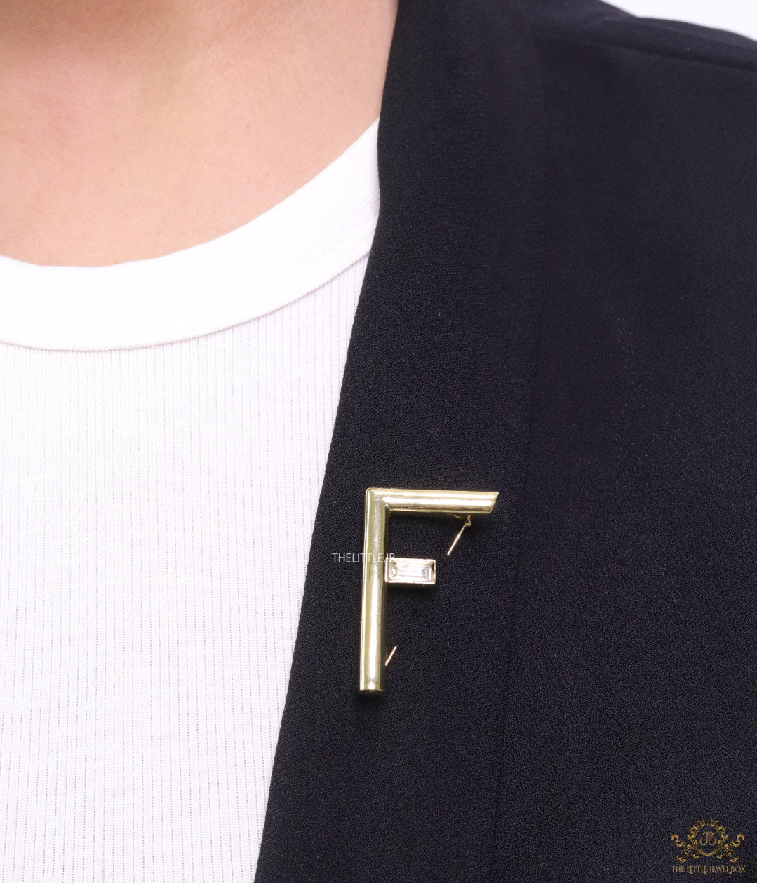 Gold plated alphabet F brooch with baguette cubic zirconia stone