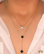 Dual chain necklace with black onyx clovers in gold finish
