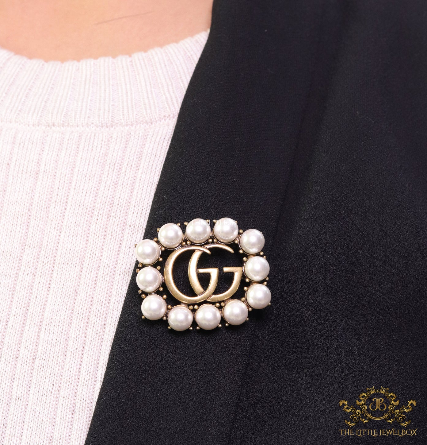 Pearls embraced alphabet brooch in gold finish