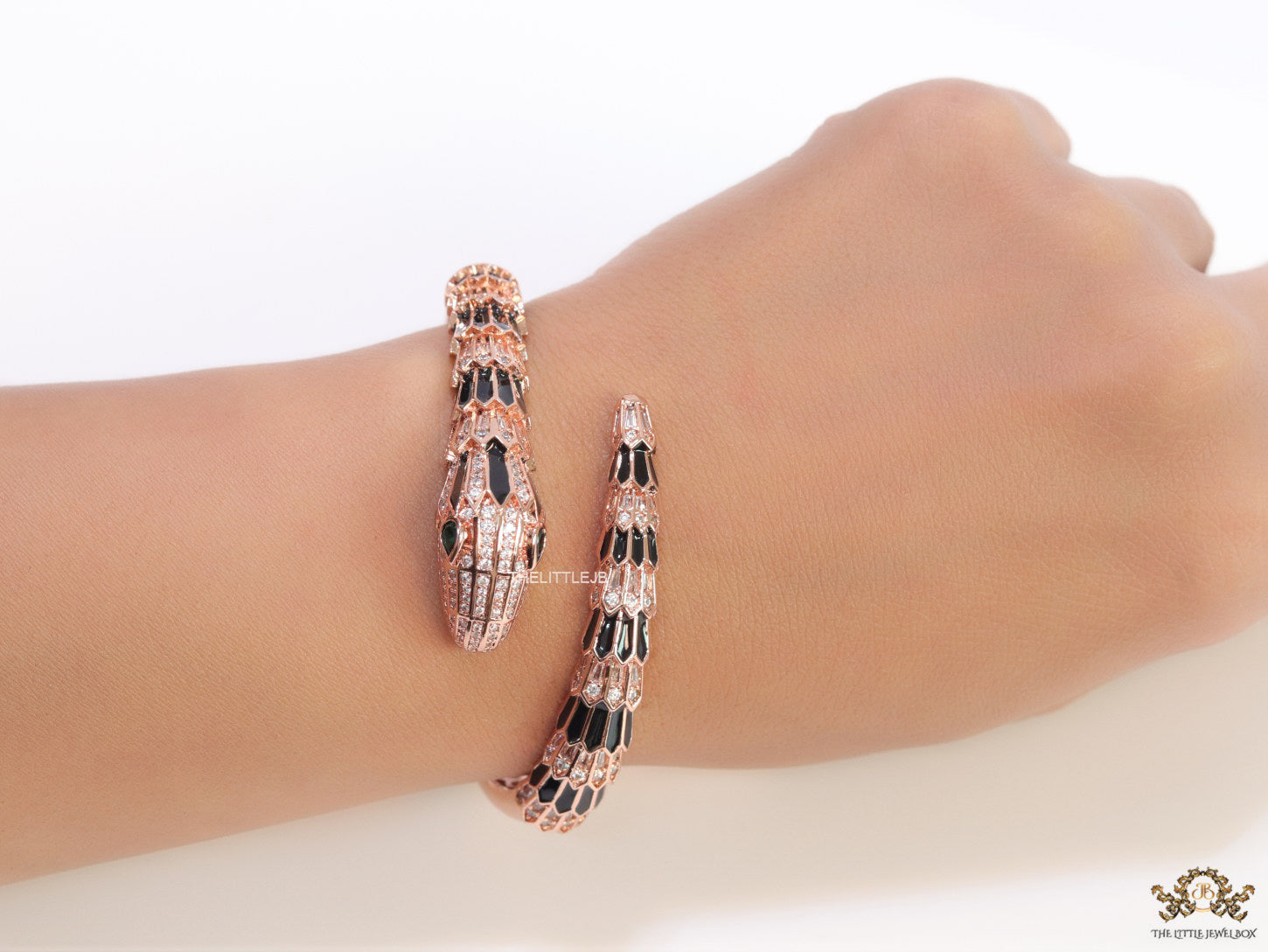 Top open serpentine black enamel bracelet with rose gold plating and cubic zirconia stones