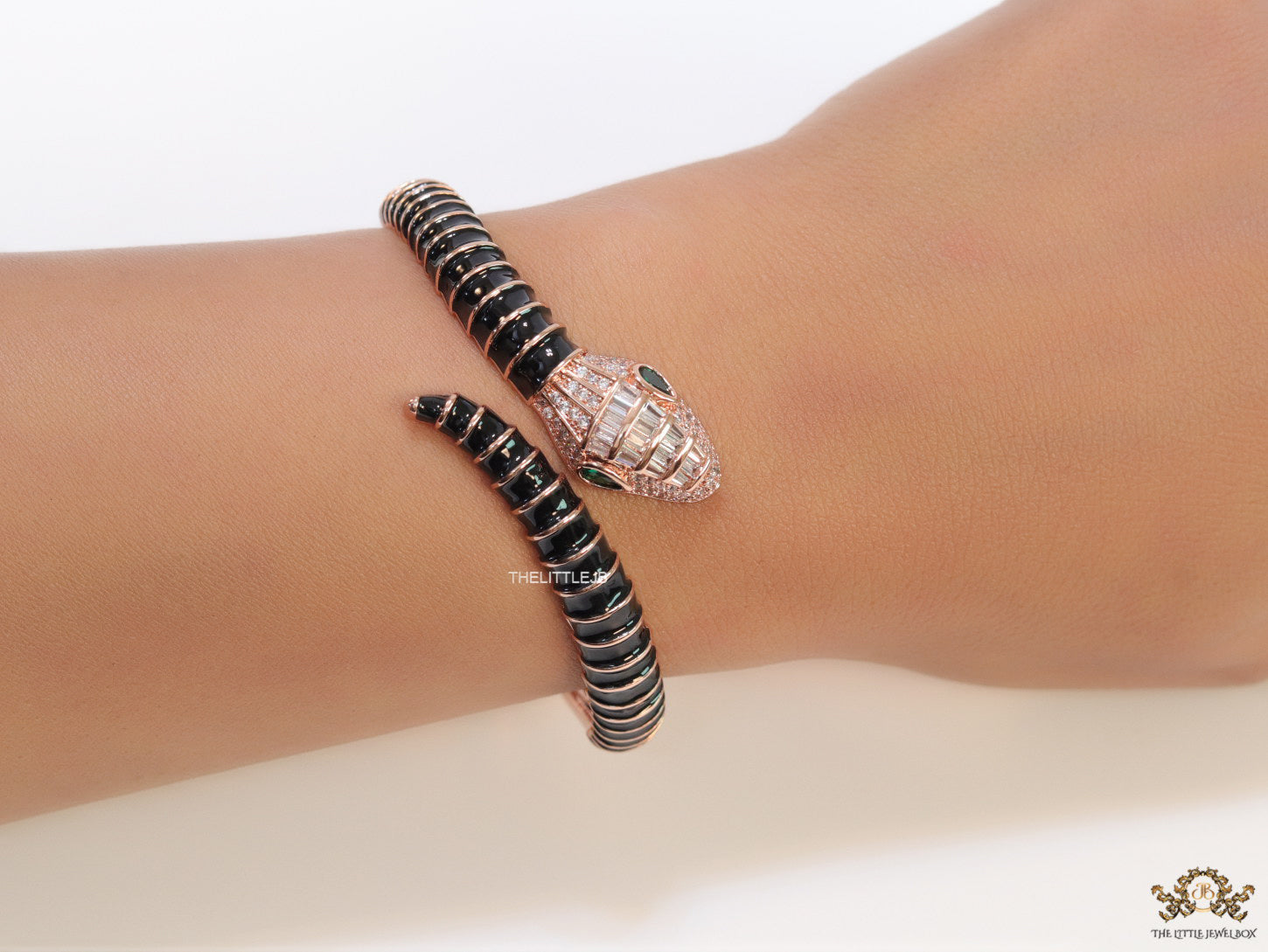 Top open snake bracelet in black enamel with rose gold plated details and cubic zirconia stones head